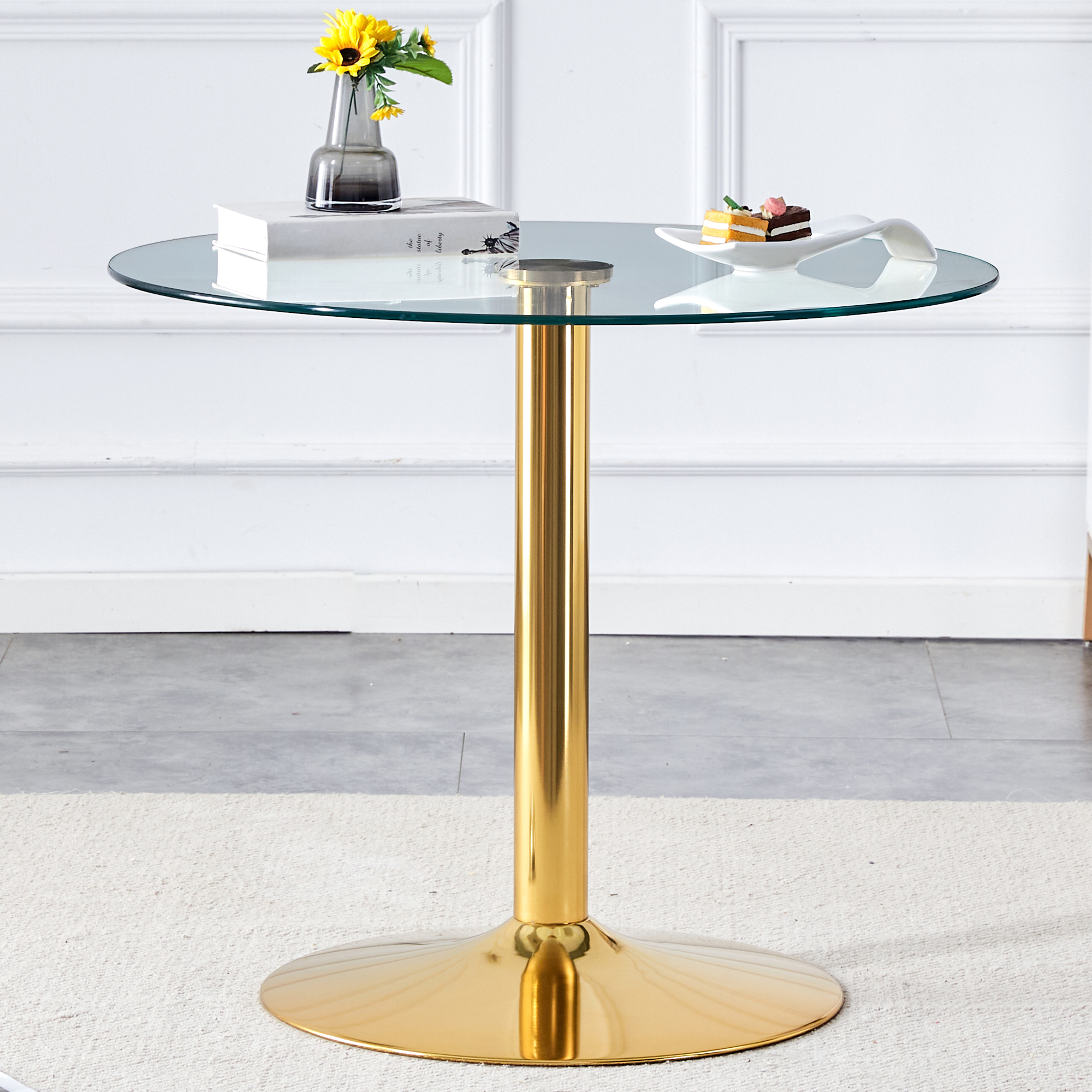 A 35-inch diameter glass top and a modern, minimalist round dining table with gold metal legs. Ideal for dining rooms, living rooms and meeting rooms. Model: DT-1166