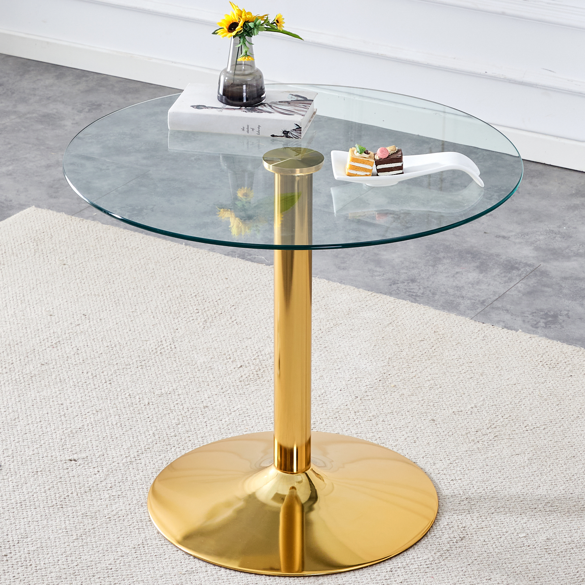 A 35-inch diameter glass top and a modern, minimalist round dining table with gold metal legs. Ideal for dining rooms, living rooms and meeting rooms. Model: DT-1166