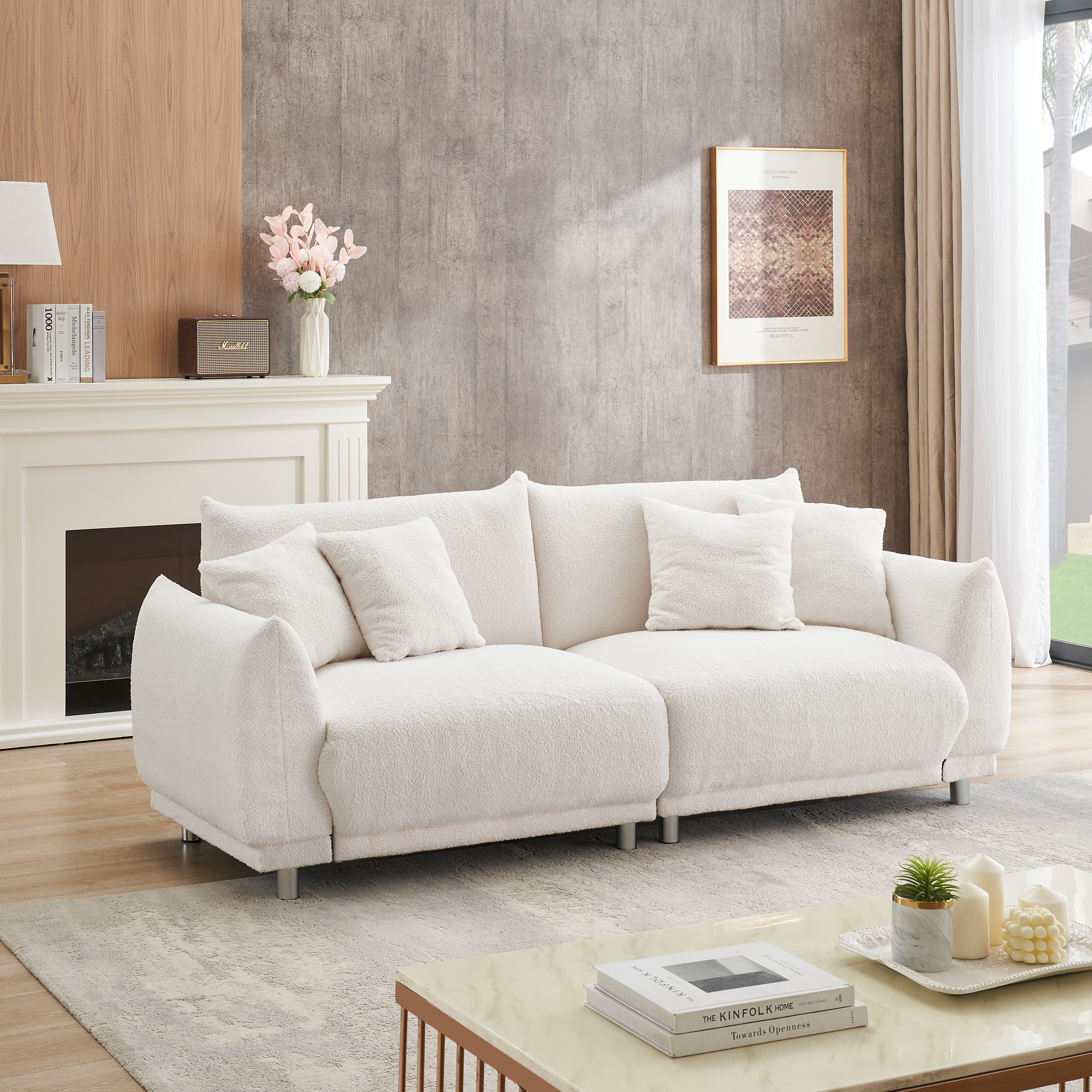 The 86.6 inch teddy wool beige sofa with four throw pillows and hardware feet can sit comfortably in an apartment bedroom without taking up space