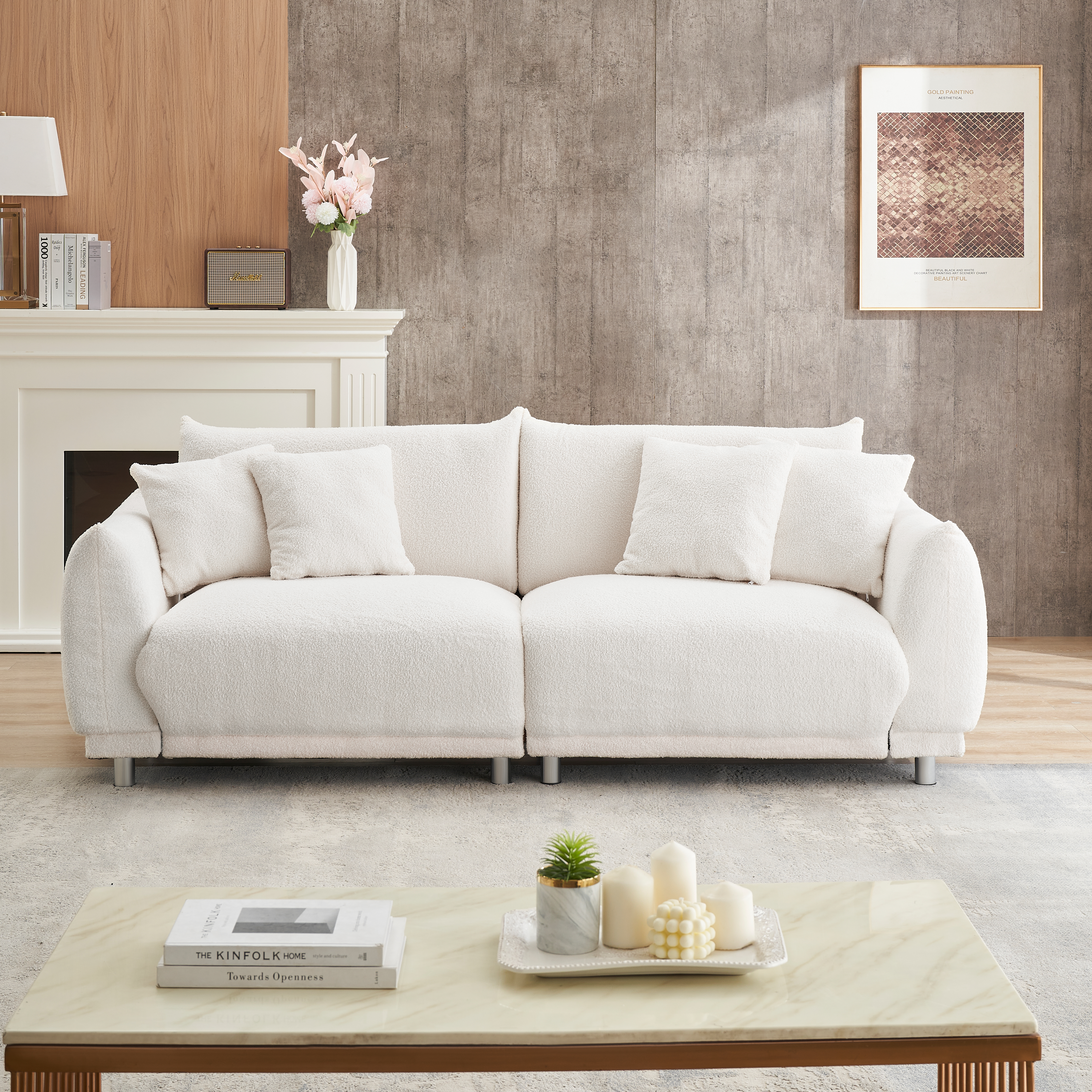 The 86.6 inch teddy wool beige sofa with four throw pillows and hardware feet can sit comfortably in an apartment bedroom without taking up space